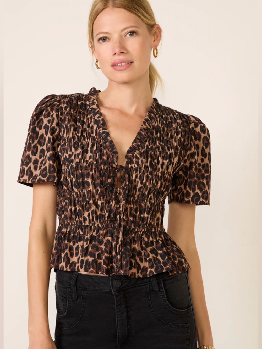 Portia Top by the brand Rails, featured in a "Brown Nala" leopard print.